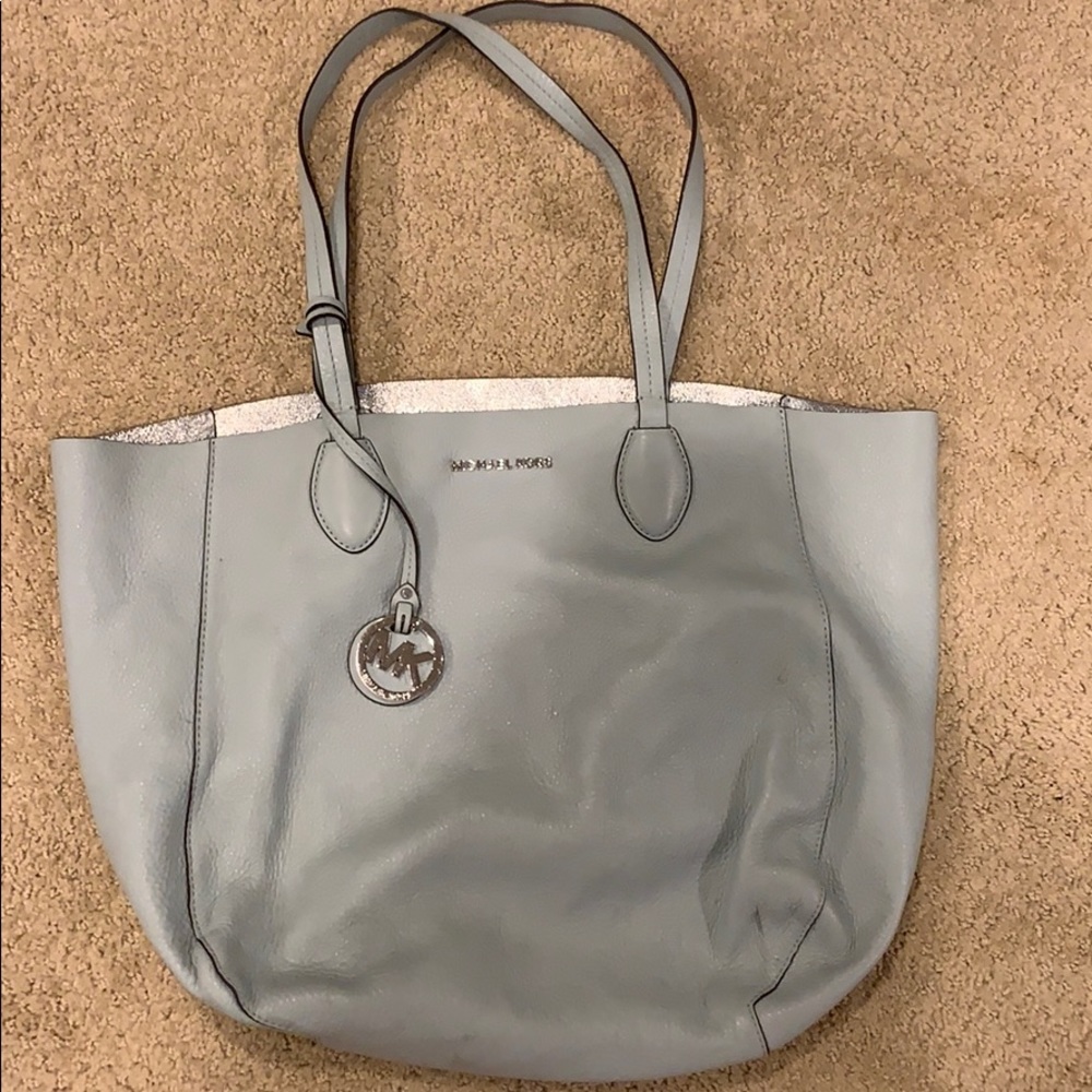 a baby blue michael cores handbag